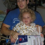 Picture of young man in hospital with daughter.