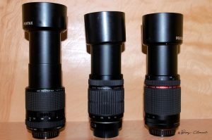 Photo of three Pentax 55-300mm lenses